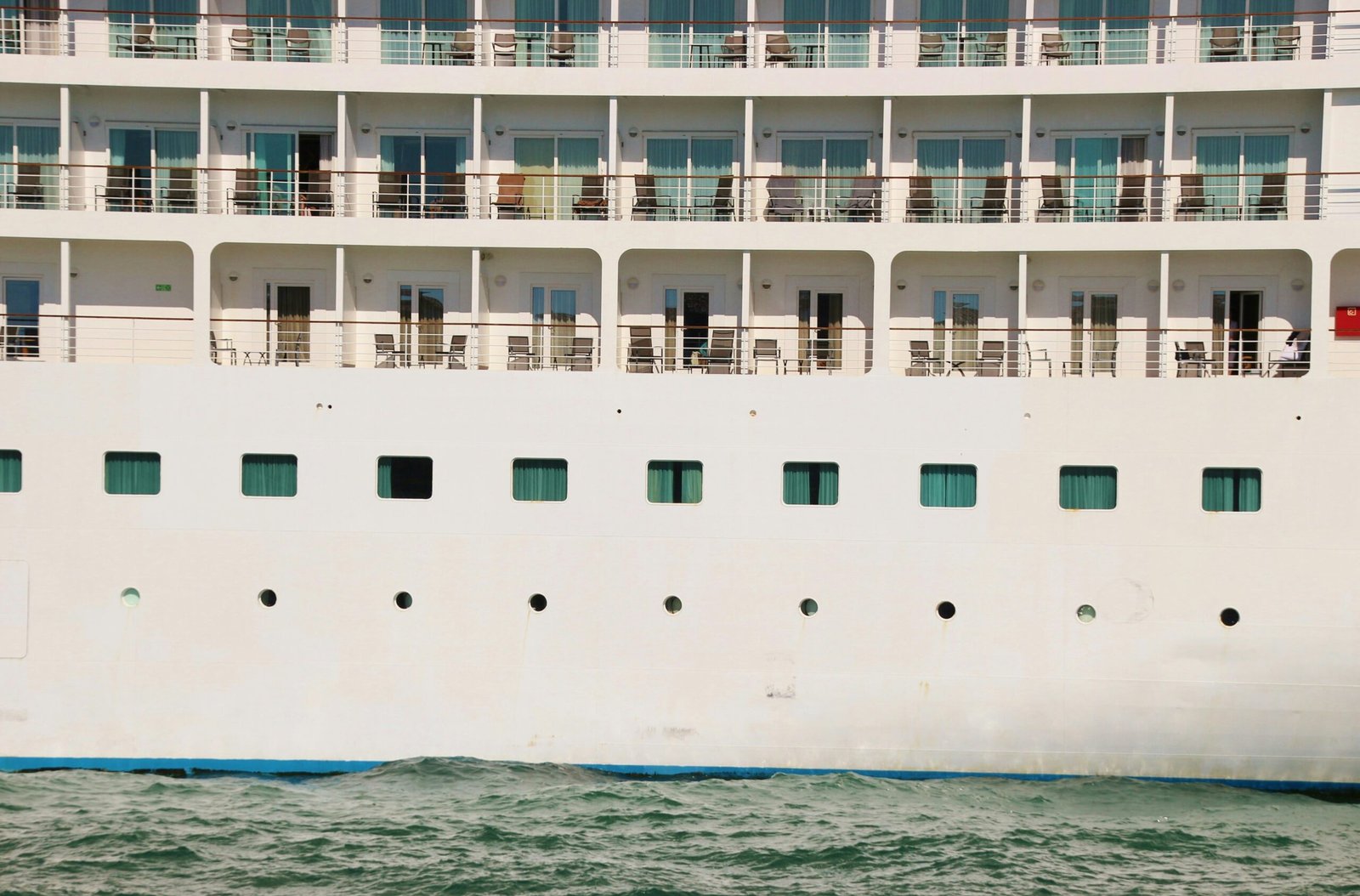 white and blue cruise ship on blue sea during daytime